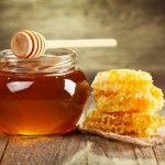 jar of honey with honeycomb